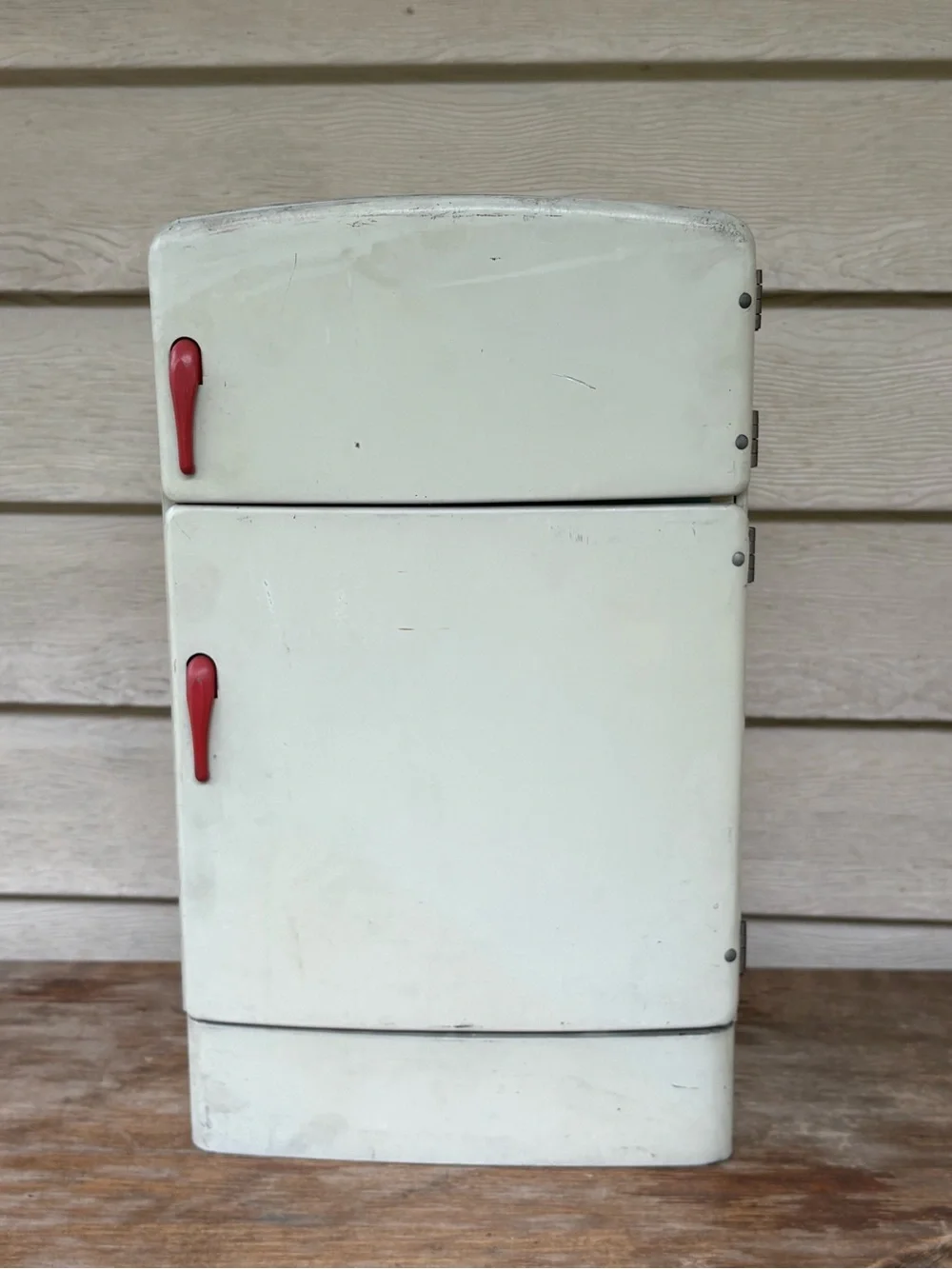 VTG 1950s Wolverine Supply metal toy refrigerator, featuring a white finish